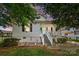 Charming home featuring a quaint front porch and well-maintained landscaping at 805 Caldwell St, Belmont, NC 28012