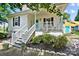 Attractive home with a welcoming front porch, complemented by neat landscaping at 805 Caldwell St, Belmont, NC 28012