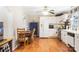 Cozy kitchen with white cabinets, laminate flooring, and eat-in dining area is perfect for Gathering meals at 805 Caldwell St, Belmont, NC 28012