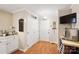Eat-in kitchen with pantry, exterior door, and adjacent breakfast nook at 805 Caldwell St, Belmont, NC 28012
