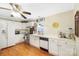 Bright kitchen with stainless steel appliances, white cabinets, and wood-look flooring at 805 Caldwell St, Belmont, NC 28012