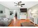 Open-concept living room boasts hardwood floors, access to the bedrooms, and a view of the backyard at 805 Caldwell St, Belmont, NC 28012