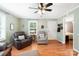 Inviting living room showcasing hardwood floors, a ceiling fan, and direct access to the bedrooms at 805 Caldwell St, Belmont, NC 28012