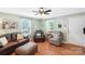 Bright living room with hardwood floors, and cozy seating arrangement creates an inviting atmosphere at 805 Caldwell St, Belmont, NC 28012