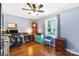 Functional office with hardwood flooring, ceiling fan, and natural light is ready for work and productivity at 805 Caldwell St, Belmont, NC 28012