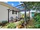 Charming patio with outdoor seating, string lights, and lush plantings offers a perfect spot for relaxation at 805 Caldwell St, Belmont, NC 28012
