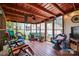 Relaxing sunroom featuring cozy seating, a ceiling fan, and views of the backyard provides a peaceful retreat at 805 Caldwell St, Belmont, NC 28012