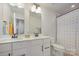 Bathroom with double sink vanity, neutral walls, and polka dot shower curtain at 808 Dogwood Creek Ln, Indian Trail, NC 28079