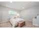 Bright bedroom features neutral walls, carpet flooring, and a window for natural light at 808 Dogwood Creek Ln, Indian Trail, NC 28079