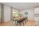 Dining room features a modern table, chairs, and access to the outdoor patio through a sliding glass door at 808 Dogwood Creek Ln, Indian Trail, NC 28079