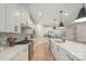 Stylish kitchen boasting white cabinetry, stainless steel appliances, and a large island, perfect for entertaining at 808 Dogwood Creek Ln, Indian Trail, NC 28079