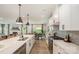 Open kitchen area with stainless appliances, large island, and white cabinets, ideal for cooking and socializing at 808 Dogwood Creek Ln, Indian Trail, NC 28079