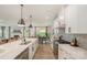 Modern kitchen features white cabinets, quartz countertops, stainless steel appliances, and an open-concept layout at 808 Dogwood Creek Ln, Indian Trail, NC 28079