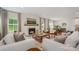Bright and spacious living room with fireplace, dining table, and open floor plan, perfect for gatherings at 808 Dogwood Creek Ln, Indian Trail, NC 28079
