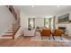 Cozy living room featuring a fireplace, comfortable seating, and a staircase leading to the upper level at 808 Dogwood Creek Ln, Indian Trail, NC 28079
