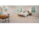 Bright main bedroom with a desk and a bench, lots of windows, and modern finishes at 808 Dogwood Creek Ln, Indian Trail, NC 28079