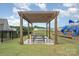 Outdoor picnic area offers a lovely spot for community gatherings with picnic tables and playground nearby at 808 Dogwood Creek Ln, Indian Trail, NC 28079