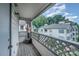 View from the balcony shows a nice view of other apartments and the wooden balcony floor at 8119 Tremaine Ct # E, Charlotte, NC 28227
