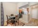 A dining area located adjacent to the kitchen, featuring a table and four chairs at 8119 Tremaine Ct # E, Charlotte, NC 28227