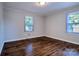 Sunlit bedroom with gleaming hardwood floors and neutral walls, creating a serene and inviting atmosphere at 828 Williams St, Gastonia, NC 28052
