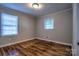 Cozy bedroom featuring gleaming hardwood floors and neutral walls, creating a serene and inviting atmosphere at 828 Williams St, Gastonia, NC 28052