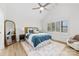 Sunlit bedroom featuring a vaulted ceiling, large window, and a comfortable bed with blue bedding at 8438 Henry Harris Rd, Fort Mill, SC 29707