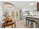Charming dining area with access to the backyard and a view of the modern kitchen at 8438 Henry Harris Rd, Fort Mill, SC 29707