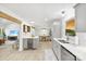 Bright, updated kitchen with stainless steel appliances, gray cabinetry, and light wood floors at 8438 Henry Harris Rd, Fort Mill, SC 29707