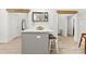 Kitchen island with seating and a view into the main bathroom and the dining area at 8438 Henry Harris Rd, Fort Mill, SC 29707