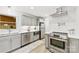 Modern kitchen with stainless steel appliances, gray cabinets, and bright lighting, ready for culinary adventures at 8438 Henry Harris Rd, Fort Mill, SC 29707