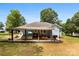 Inviting covered patio with a full outdoor kitchen and living space great for entertaining friends and Gathering at 8438 Henry Harris Rd, Fort Mill, SC 29707