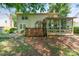View of a backyard with a two story home and screened in sunroom at 8701 Appaloosa Way Ln, Charlotte, NC 28216