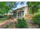 Backyard view of home with a sunroom, deck, and fenced yard at 8701 Appaloosa Way Ln, Charlotte, NC 28216