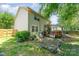 Backyard view of a two story home with sunroom and brick patio at 8701 Appaloosa Way Ln, Charlotte, NC 28216