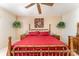 Bedroom featuring red bedding and wooden furniture at 8701 Appaloosa Way Ln, Charlotte, NC 28216