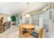 Bright dining area features a round wood table with seating for four by a window at 8701 Appaloosa Way Ln, Charlotte, NC 28216