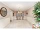 Traditional dining room with neutral walls, classic chandelier and simple decor at 8701 Appaloosa Way Ln, Charlotte, NC 28216
