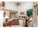 Inviting living room with high ceilings, a ceiling fan, traditional decor, and ample natural light at 8701 Appaloosa Way Ln, Charlotte, NC 28216