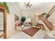 Bright living room featuring high ceilings, a ceiling fan, traditional decor, and ample natural light at 8701 Appaloosa Way Ln, Charlotte, NC 28216