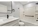 Bright bathroom featuring a tub with white tiled enclosure and sleek black fixtures at 10514 Harbor Dr, Charlotte, NC 28214