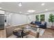Inviting living room featuring modern decor, wood floors, and an abundance of natural light at 10514 Harbor Dr, Charlotte, NC 28214