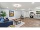 Inviting living area featuring an open floor plan, stylish decor, and seamless flow to the modern kitchen at 10514 Harbor Dr, Charlotte, NC 28214