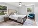 Comfortable main bedroom with neutral walls, large bed, bedside tables, and a blue accent chair at 10514 Harbor Dr, Charlotte, NC 28214