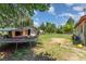 View of house exterior with lawn, shed, and old trampoline at 107 Skyuka Rd, Statesville, NC 28677