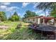 View of house exterior with lawn, debris, and trampoline at 107 Skyuka Rd, Statesville, NC 28677