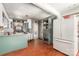Kitchen features wood floors, white cabinets, a center island and stainless steel refrigerator at 107 Skyuka Rd, Statesville, NC 28677