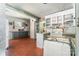 Kitchen area featuring wood floors, white cabinets, and a small center island at 107 Skyuka Rd, Statesville, NC 28677