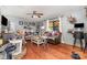 Living room with hardwood floors, a fireplace, and natural light from a window at 107 Skyuka Rd, Statesville, NC 28677