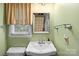Bathroom featuring a vintage style sink and neutral walls at 111 Beacon Hills Dr, Gastonia, NC 28056