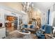 Inviting living room shows an open staircase, lots of seating, and connection to the kitchen, creating a harmonious living space at 111 Beacon Hills Dr, Gastonia, NC 28056
